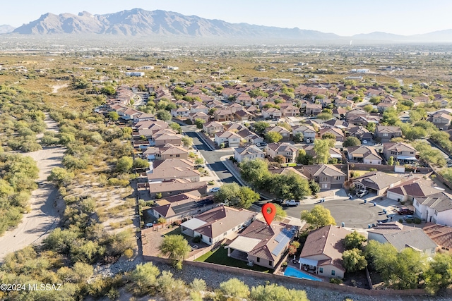 birds eye view of property with a mountain view