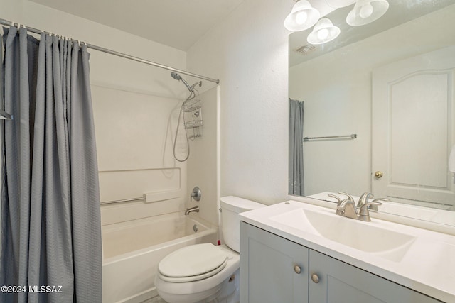 full bathroom with vanity, shower / bath combination with curtain, and toilet