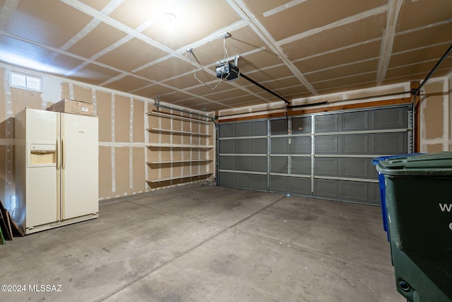 garage with white fridge with ice dispenser and a garage door opener