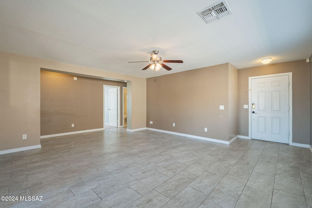 empty room featuring ceiling fan