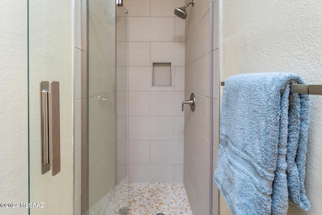 bathroom featuring an enclosed shower