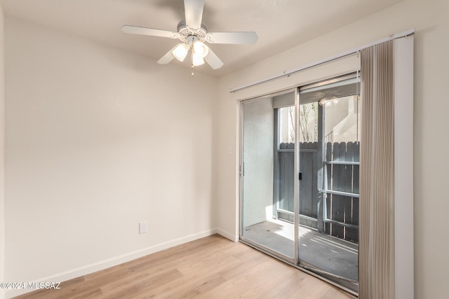 spare room featuring light hardwood / wood-style flooring and ceiling fan