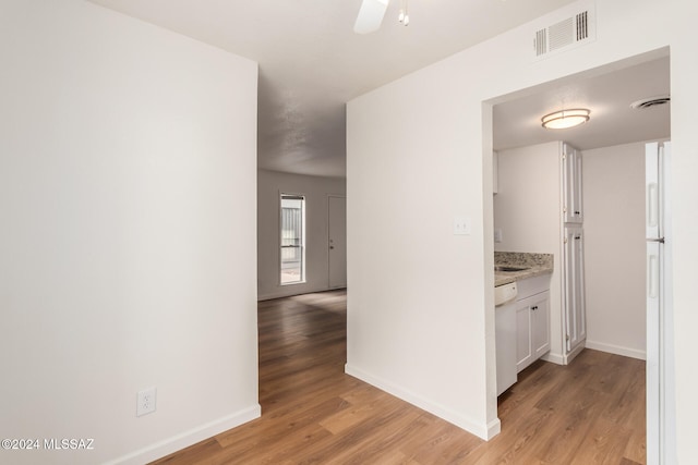 corridor featuring light hardwood / wood-style floors