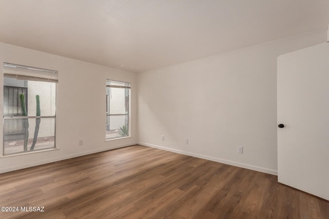 unfurnished room featuring hardwood / wood-style floors