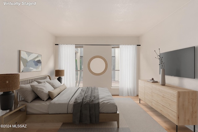 bedroom with light hardwood / wood-style floors