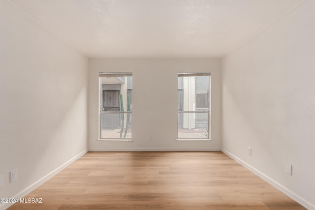 empty room with light wood-type flooring