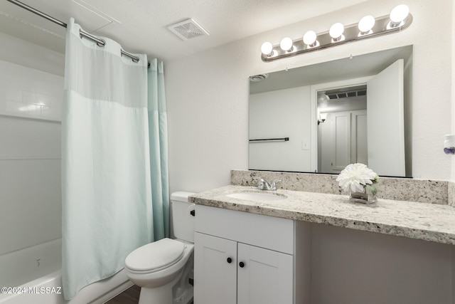 full bathroom featuring toilet, shower / tub combo, vanity, and a textured ceiling