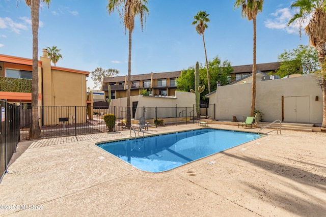 view of swimming pool featuring a patio area