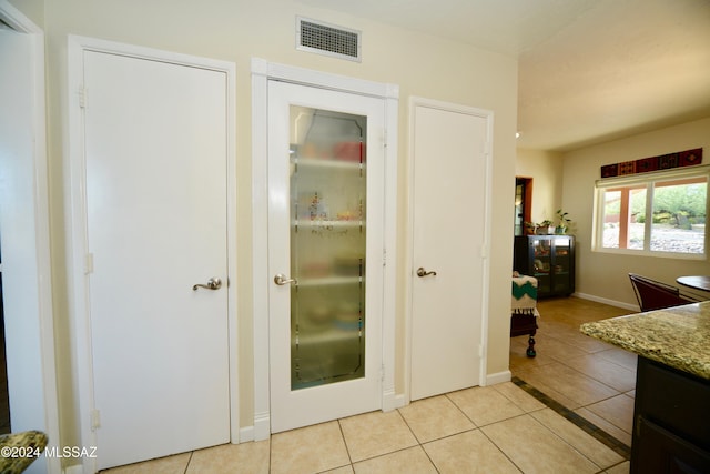 interior space featuring light tile patterned floors