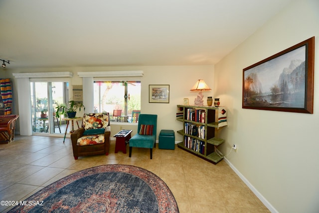 living area featuring light tile patterned flooring