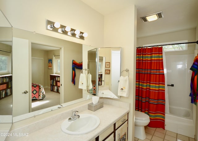 full bathroom with toilet, vanity, shower / bath combination with curtain, and tile patterned floors