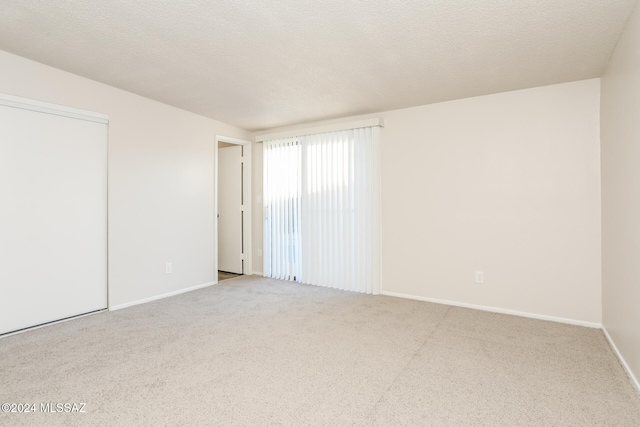 spare room with a textured ceiling