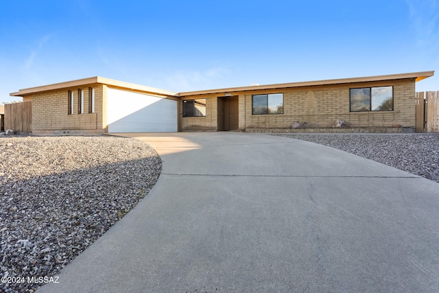 single story home featuring a garage