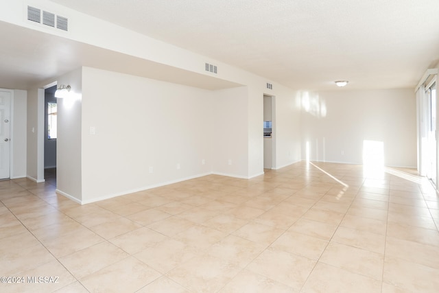 view of tiled spare room