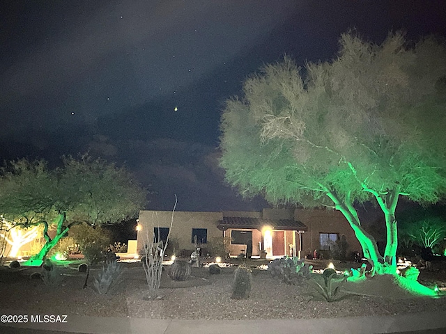 view of back house at night