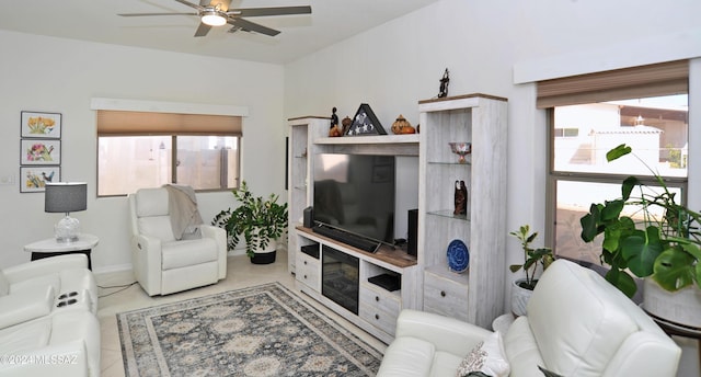 living room with ceiling fan and light tile patterned floors