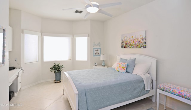 bedroom featuring light tile patterned floors and ceiling fan