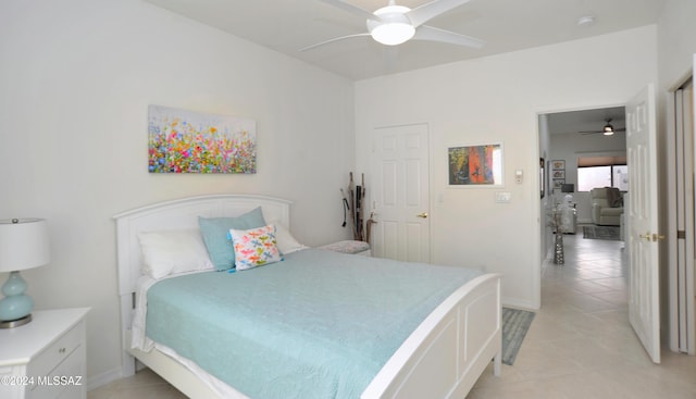 bedroom featuring ceiling fan and light tile patterned floors