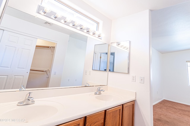 bathroom featuring a wealth of natural light and vanity