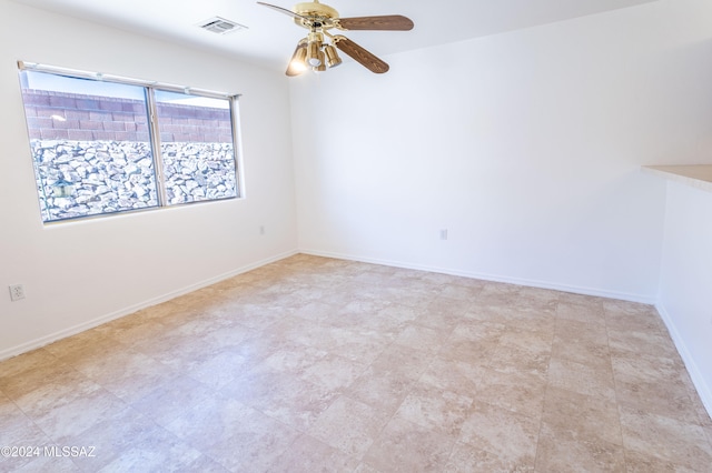 unfurnished room featuring ceiling fan