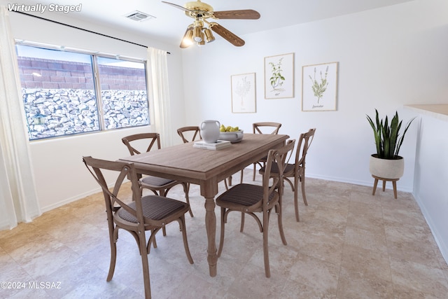 dining space with ceiling fan