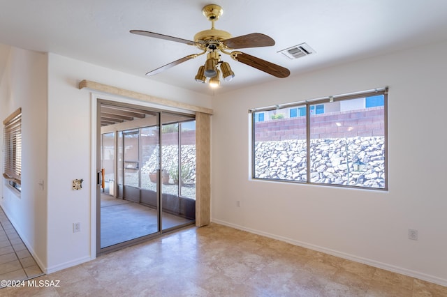 287 N Via Ln, Castellana, Green Valley, AZ 85614 - unfurnished room with baseboards and a ceiling fan