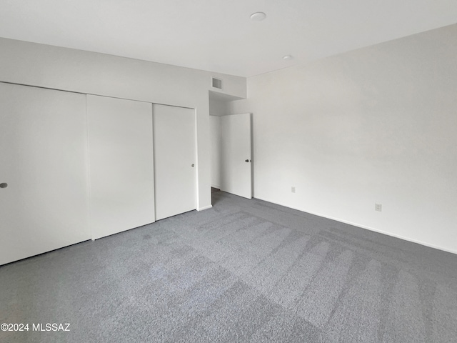 unfurnished bedroom featuring a closet