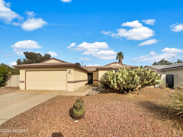 single story home featuring a garage