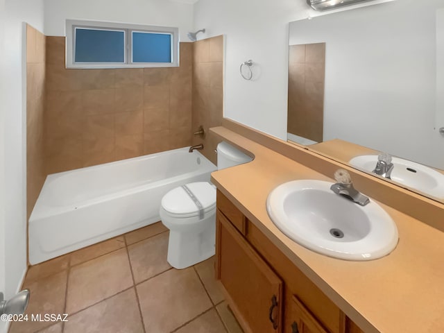 full bathroom with toilet, vanity, tiled shower / bath, and tile patterned flooring