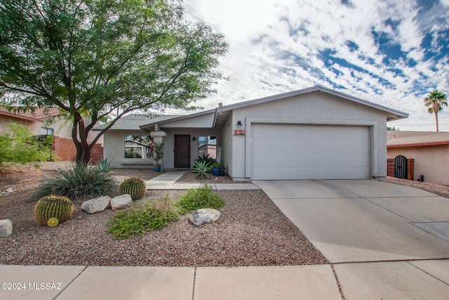 ranch-style home featuring a garage