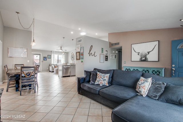 living room featuring ceiling fan and light tile patterned flooring