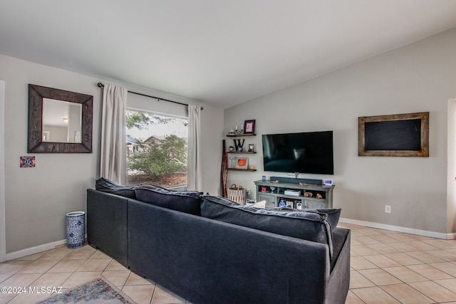 living room with light tile patterned floors and vaulted ceiling