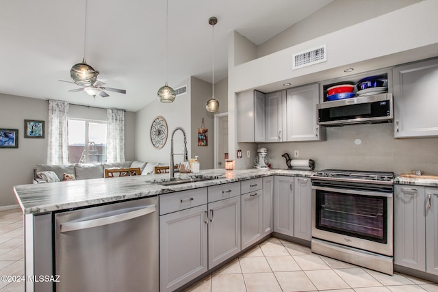 kitchen featuring sink, ceiling fan, gray cabinets, appliances with stainless steel finishes, and kitchen peninsula