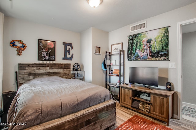 bedroom with light hardwood / wood-style flooring