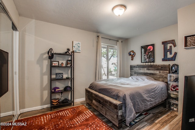 bedroom featuring hardwood / wood-style floors