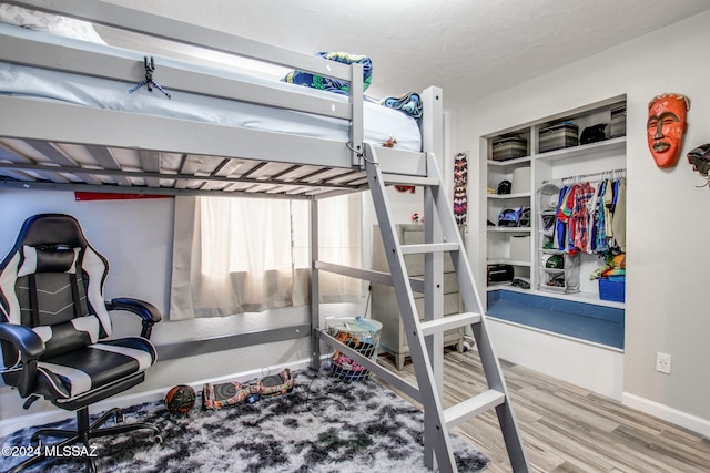 bedroom featuring hardwood / wood-style floors