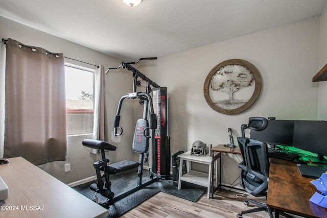 exercise area with hardwood / wood-style flooring