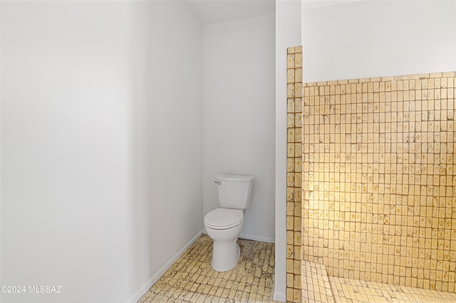 bathroom featuring tile patterned flooring and toilet