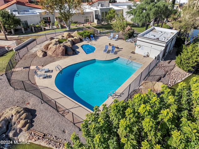 view of swimming pool with a patio