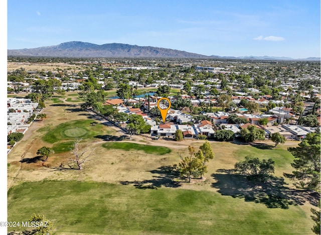 birds eye view of property with a mountain view