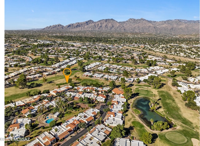 drone / aerial view featuring a water and mountain view