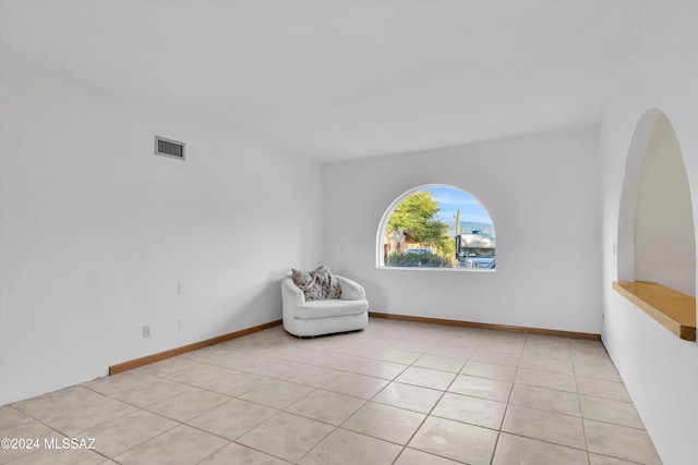 unfurnished room featuring light tile patterned floors