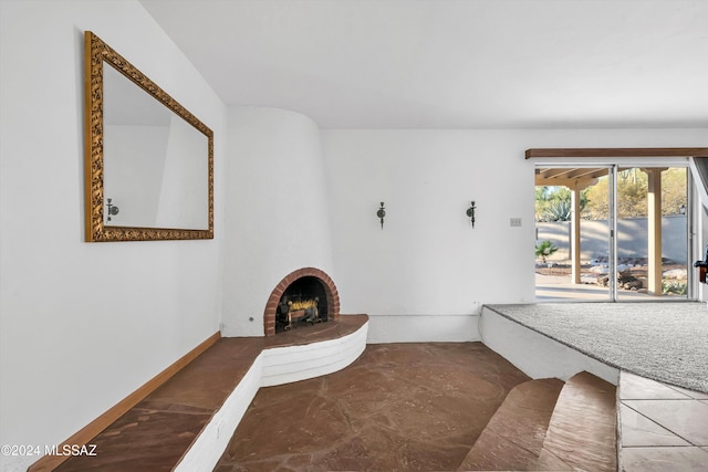 bathroom with a brick fireplace