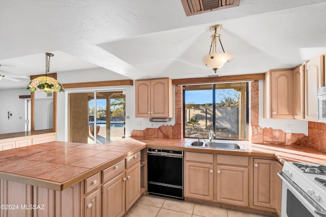 kitchen with tile counters, sink, light tile patterned floors, white appliances, and decorative light fixtures