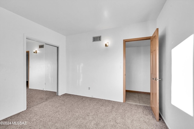 interior space with a closet and carpet flooring