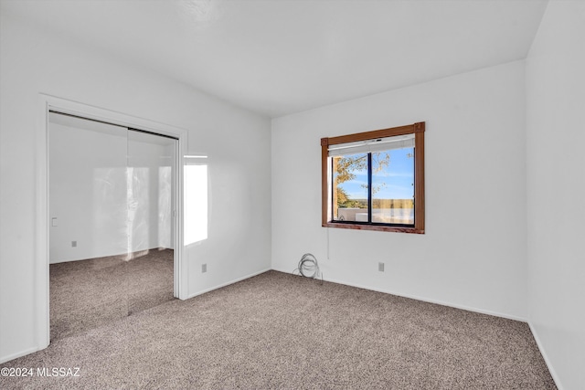 empty room with carpet flooring