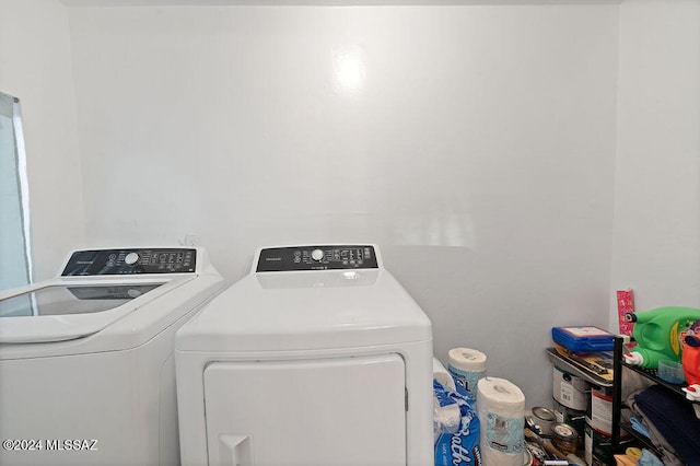 laundry area featuring washing machine and clothes dryer