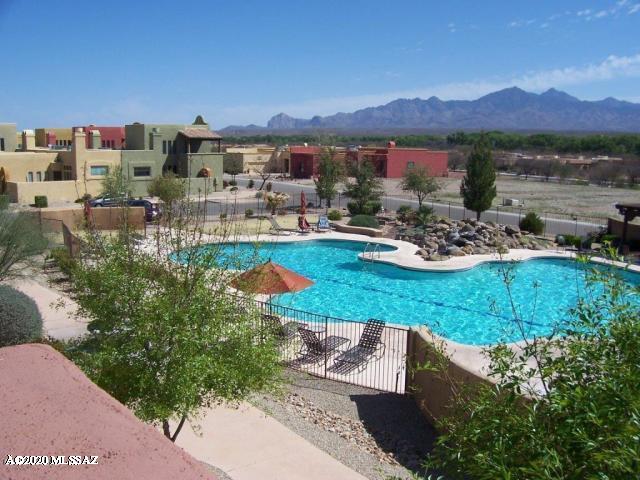 view of pool with a patio area and a mountain view