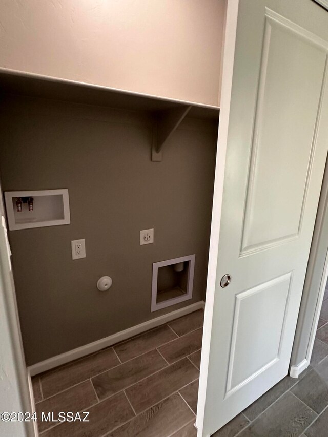 clothes washing area featuring dark wood-type flooring, washer hookup, hookup for a gas dryer, and hookup for an electric dryer