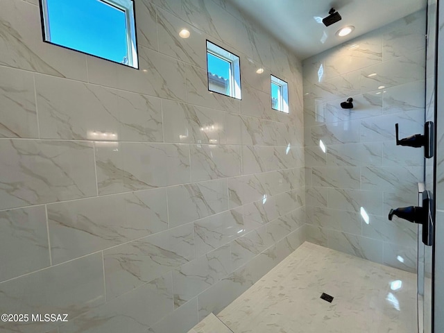 bathroom with a tile shower